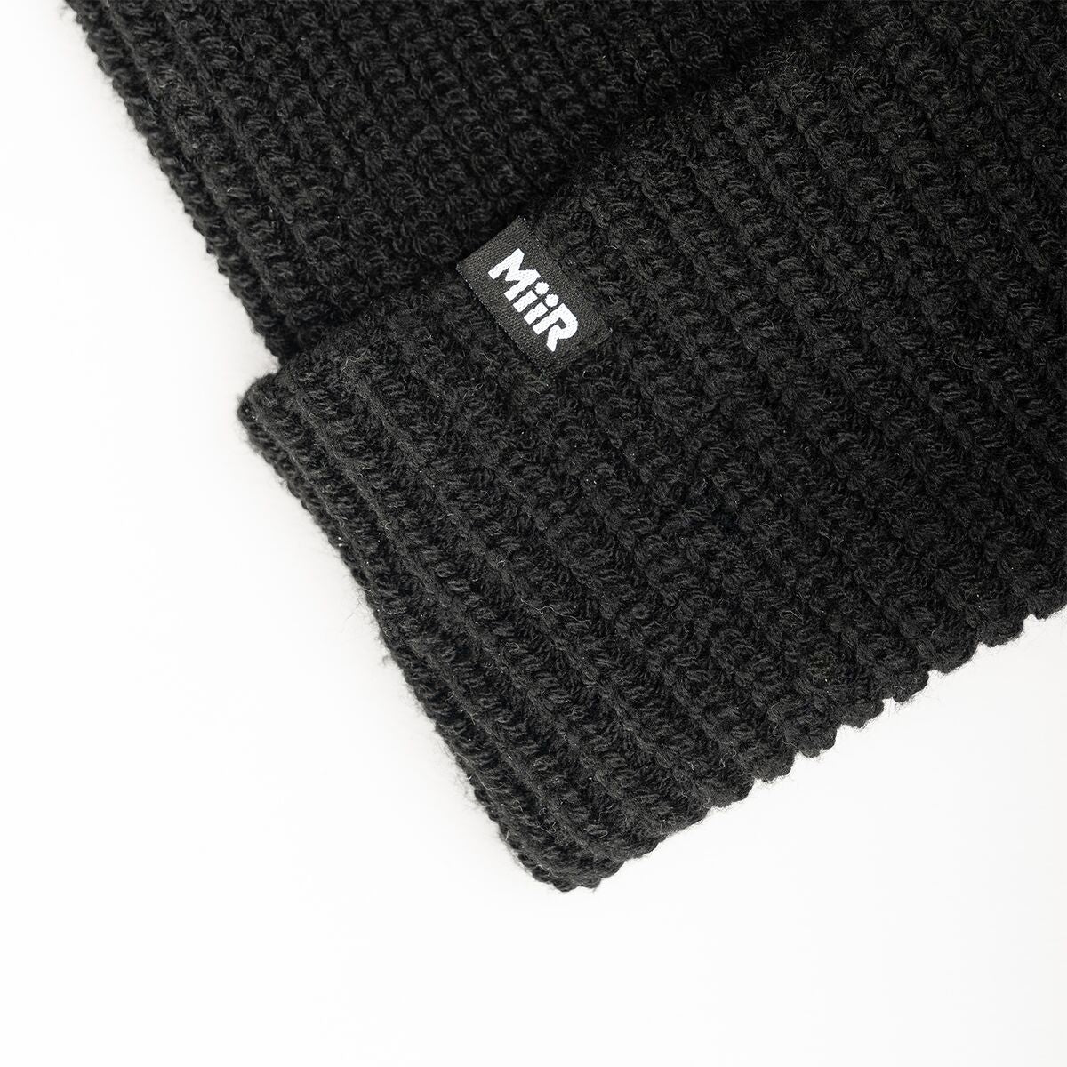 recycled-poly-rib-beanie-u9 WebPDP-RecycledPolyRibBeanie_Studio_TagDetail_Black__BNE002002OS.jpg